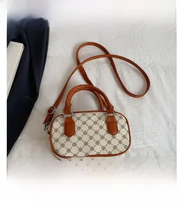 Retro Boston bag size comparison with smartphone on textured background