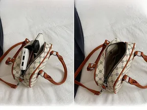Interior view showing capacity for smartphone and power bank in clover pattern bag
