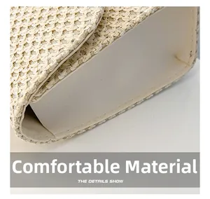 Detail showing the comfortable fabric and texture of the beige woven straw handbag