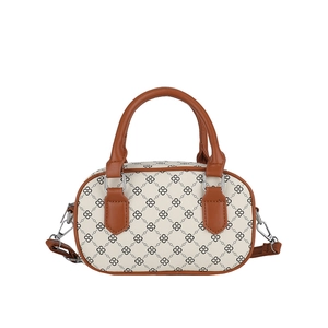 Retro barrel handbag with white patterned base and brown leather accents for daily wear