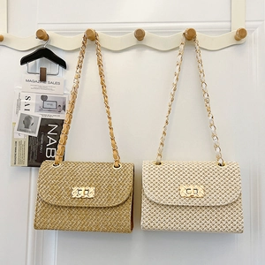 Fashionable straw square handbags in tan and cream with gold chain straps and metal buckles
