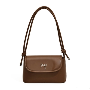Classic dark brown leather shoulder bag featuring a silver bow buckle and knot strap detail