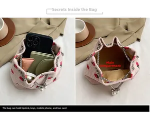Pink corduroy strawberry bucket bag interior showing capacity for phone and cosmetics