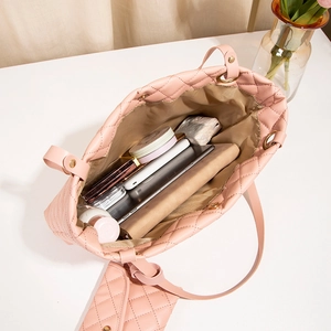 Pink quilted tote bag with matching pouch showing spacious interior and daily essentials