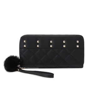 Women's black quilted long zipper wallet with gold rivets and faux fur pompom charm