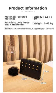 Macro view of a black quilted lady's purse with gold studs and faux fur pompom charm