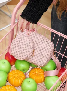 Detailed top view of a pink floral crossbody bag with a round coin purse in a pink basket