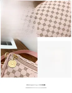 Detailed macro view of the premium leather texture and smooth golden zipper on the floral bag