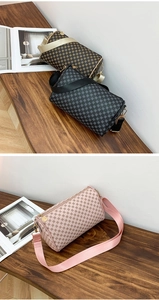 Detailed view of cylindrical pillow bags with floral patterns and wide woven straps