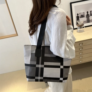 Minimalist black and white plaid tote bag with wide shoulder straps for women's daily commute