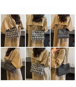 Detail shots of plaid shoulder bag with chain strap and small bow on textured fabric