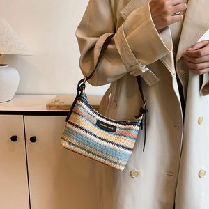 Rainbow woven straw shoulder bag with multi-color stripes and brown leather strap