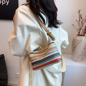 Large colorful rainbow woven straw tote bag with brown leather strap for beach or daily use