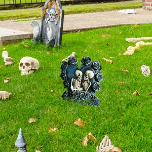 Outdoor Halloween decor set featuring skeleton couple and RIP tombstone garden stakes