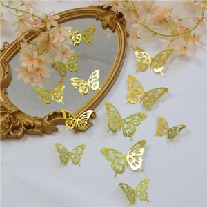 Detail of hollow golden glitter butterfly stickers on a decorative vintage mirror