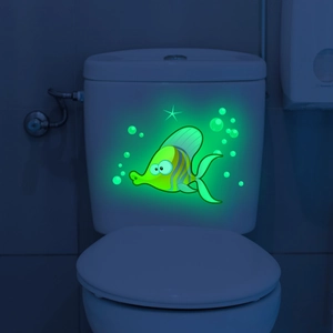 Glow in the dark green fish wall sticker with bubbles on white bathroom toilet tank