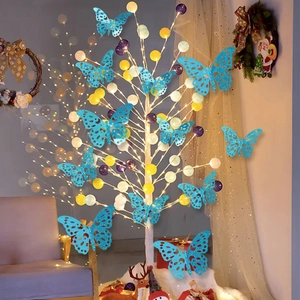 Detailed view of 12 blue hollow 3D glitter butterflies on a glowing decorative tree