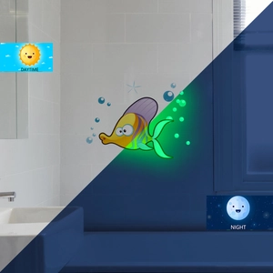 Luminous tropical fish wall sticker showing daytime color and green glow at night