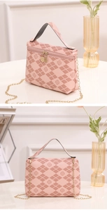 Detailed view of pink quilted handbag with clover pattern and gold chain strap detail