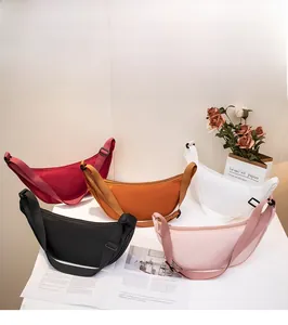 Nylon dumpling bags in five colors showing multi-layer storage and wide shoulder straps