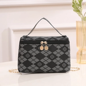 Quilted clover print handbag with gold chain strap and top handle in black and grey