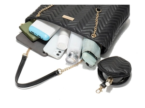 Detail of open quilted tote bag showing large capacity for tablet and cosmetics
