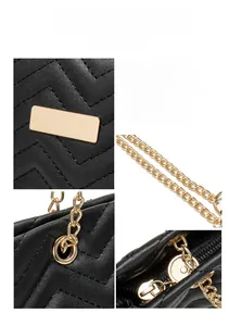 Detail of black quilted leather tote showing gold metal buckles and luxury chain strap