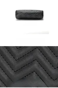 Macro detail of wave quilted black tote bag showing premium leather texture and stitching