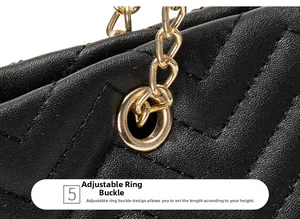 Close-up of golden adjustable chain buckle on black V-quilted faux leather tote bag