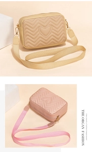 Detail of wave quilted crossbody bags with heart embroidery in beige and pink shades