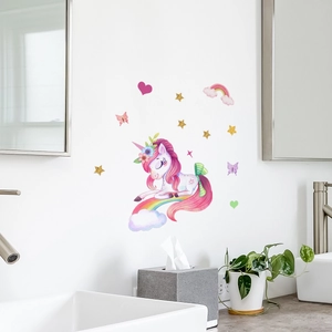 Wall decal detail showing pink unicorn and rainbow stickers on clean white bathroom walls