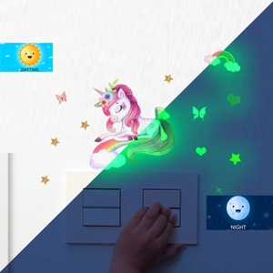 Luminous unicorn wall stickers showing glowing stars and butterflies in daytime and night