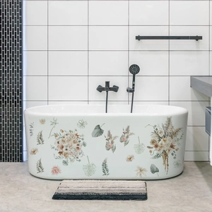Floral leaf wall stickers on a modern white bathtub for elegant bathroom decor