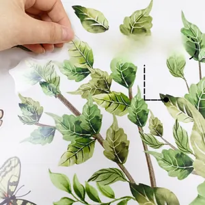 Detail of self-adhesive watercolor leaf wall sticker showing easy peel backing
