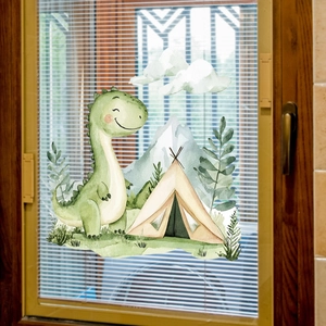 Cartoon dinosaur and tent watercolor window decals on a white wooden frame window