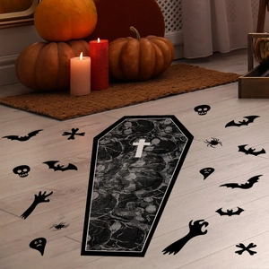 Halloween coffin and bat stickers on wood floor with pumpkins and candles decor