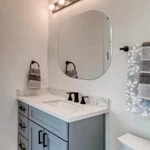 Frameless organic rectangular wall mirror for modern bathroom decor above vanity