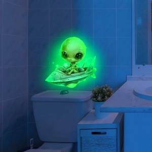 Luminous green alien spaceship wall sticker glowing in dark bathroom decor
