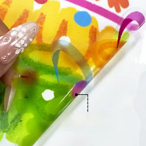 Detail showing double-sided colorful hand-drawn patterns on transparent window film