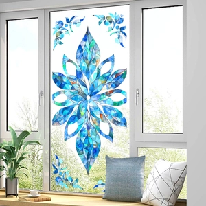 Detailed blue mandala stained glass window film on a balcony door showing vivid floral patterns