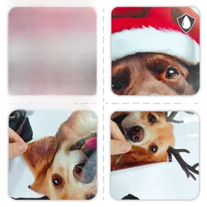 Close-up of waterproof Christmas dog window decals showing front and back double-sided view