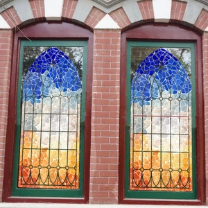 Artistic cathedral glass window film with colorful gradient mosaic geometric patterns