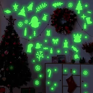 Leuchtendes Weihnachts Wandtattoo Set mit Weihnachtsmann und Schneeflocken in Neongrün