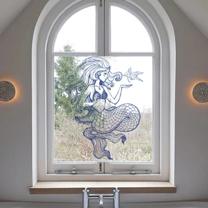 Blue hand-drawn mermaid window decal showing double-sided view on a glass window