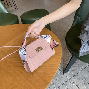 Pink checkered embossed handbag with printed silk scarf and gold twist lock closure