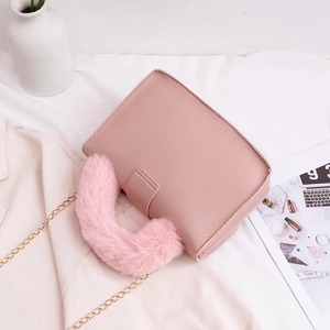Pink faux fur handle chain crossbody bag for women with golden metal strap detail