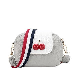 Mini crossbody bag with cherry detail and red white blue striped shoulder strap