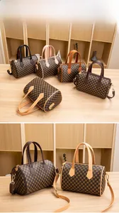 Detail showing various colors of Boston pillow bags with printed geometric patterns