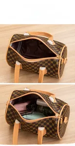 Detail view of large capacity boston bag showing internal storage for cosmetics and essentials