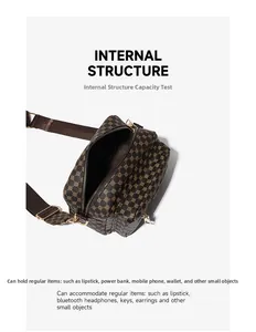 Internal structure detail of a brown polka dot crossbody camera bag with dual compartments